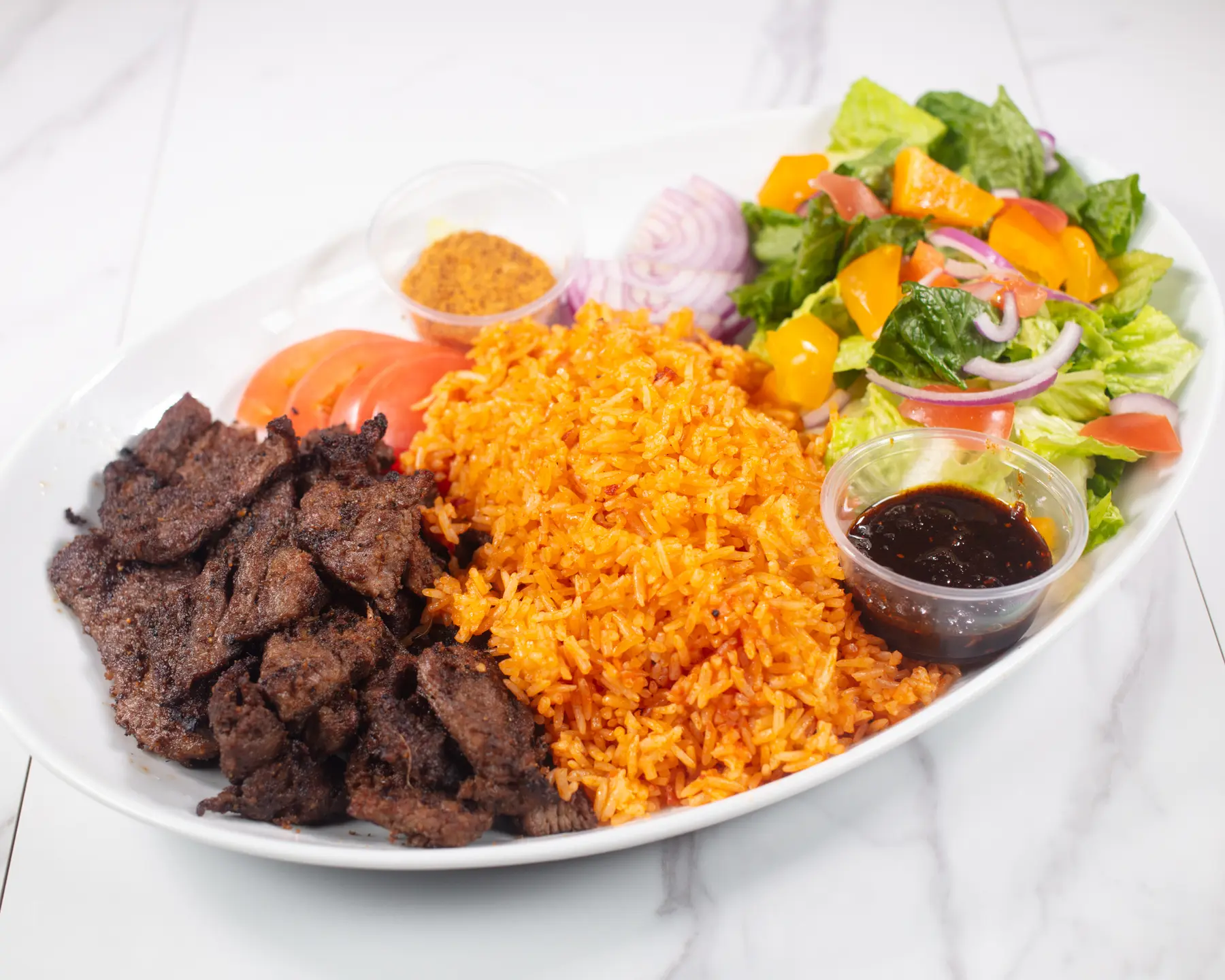 Suya and jollof served at Afro Fusion Resto
